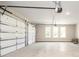 Spacious three car garage with automatic door openers and windows for natural light at 1150 Sweet Mia Ln, Powder Springs, GA 30127