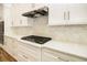 Kitchen featuring quartz countertops, white cabinets, stainless steel appliances and herringbone backsplash at 1150 Sweet Mia Ln, Powder Springs, GA 30127