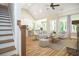 Open-concept living area with fireplace and hardwood floors flowing into the kitchen at 1150 Sweet Mia Ln, Powder Springs, GA 30127