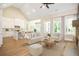 Bright and airy living room with vaulted ceilings, fireplace, and abundant natural light at 1150 Sweet Mia Ln, Powder Springs, GA 30127