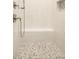 Stylish shower featuring intricate tile work, a built-in bench, and modern fixtures at 1150 Sweet Mia Ln, Powder Springs, GA 30127