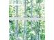 Close-up of a multi-paned window providing an obscured, abstract view of the surrounding landscape at 1150 Sweet Mia Ln, Powder Springs, GA 30127