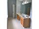 Bathroom with a double sink vanity and tile flooring at 1951 Bergerac Sw Ct, Marietta, GA 30008