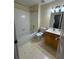Bathroom featuring a tub/shower combo, new toilet, vanity and ceramic tile flooring at 1951 Bergerac Sw Ct, Marietta, GA 30008