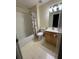 Bathroom featuring a vanity with a sink, toilet, bathtub and shower with colorful shower curtain at 1951 Bergerac Sw Ct, Marietta, GA 30008