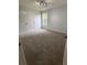 Bedroom featuring light gray walls, a large closet, a window, and gray carpet at 1951 Bergerac Sw Ct, Marietta, GA 30008