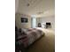 Bedroom with carpeted floors, large bed, and a large window offering natural light at 1951 Bergerac Sw Ct, Marietta, GA 30008