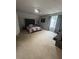 Spacious bedroom with large bed, carpeted floors, and ample natural light at 1951 Bergerac Sw Ct, Marietta, GA 30008