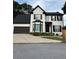 Charming two-story home with a well-maintained front yard and attached two-car garage at 1951 Bergerac Sw Ct, Marietta, GA 30008