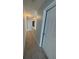 Hallway with grey walls and carpet, showing the transition between spaces at 1951 Bergerac Sw Ct, Marietta, GA 30008