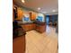 Spacious kitchen featuring tile floors, wood cabinets, and black granite countertops at 1951 Bergerac Sw Ct, Marietta, GA 30008
