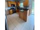 The kitchen has tile floors, wooden cabinets and stainless-steel appliances at 1951 Bergerac Sw Ct, Marietta, GA 30008