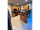 Modern kitchen featuring tile floors, wood cabinets, stainless appliances and granite counters at 1951 Bergerac Sw Ct, Marietta, GA 30008