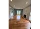 Bright living room with hardwood floors, fireplace, and large window at 1951 Bergerac Sw Ct, Marietta, GA 30008