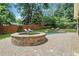 Beautiful backyard with a stone hot tub and a sparkling pool, perfect for relaxation and entertaining at 47 Roseclair Se Dr, Atlanta, GA 30317