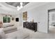 Bright primary bedroom with patterned ceiling, dresser, and comfortable seating area at 47 Roseclair Se Dr, Atlanta, GA 30317