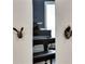 Decorative animal-shaped hardware adorns the door of a room with a view of a black piano at 47 Roseclair Se Dr, Atlanta, GA 30317