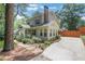 Charming home showcasing a long driveway, well-maintained lawn, and blooming garden beds at 47 Roseclair Se Dr, Atlanta, GA 30317
