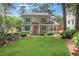 Charming home with green lawn and mature landscaping at 47 Roseclair Se Dr, Atlanta, GA 30317