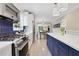 Bright kitchen featuring stainless steel appliances and open access to the living room at 47 Roseclair Se Dr, Atlanta, GA 30317