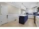 Kitchen features a large island, stainless appliances, and stylish lighting at 47 Roseclair Se Dr, Atlanta, GA 30317