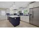 Modern kitchen with stainless steel appliances and a navy blue island at 47 Roseclair Se Dr, Atlanta, GA 30317