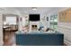 Bright living room with a fireplace, neutral walls, and a comfortable blue velvet sofa at 47 Roseclair Se Dr, Atlanta, GA 30317