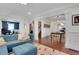 Bright living room with blue sofa, wood floors, and stylish decor at 47 Roseclair Se Dr, Atlanta, GA 30317
