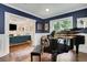 Cozy music room with a view into the living room with a large piano and hardwood floors at 47 Roseclair Se Dr, Atlanta, GA 30317