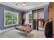 Well-organized walk-in closet with custom shelving, storage, and bright blue walls at 47 Roseclair Se Dr, Atlanta, GA 30317