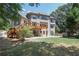 Expansive backyard featuring a wooden deck and a spacious stone patio for outdoor entertaining at 5925 Water Mark Dr, Cumming, GA 30040