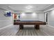 Basement featuring pool table, wet bar and neutral paint at 5925 Water Mark Dr, Cumming, GA 30040