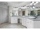 Bright bathroom featuring granite countertops, dual sinks, and ample cabinet space at 5925 Water Mark Dr, Cumming, GA 30040