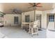 Covered patio with wooden seating and ceiling fans, providing an outdoor living space at 5925 Water Mark Dr, Cumming, GA 30040