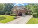 Beautiful brick home with a well-manicured lawn and inviting curb appeal at 5925 Water Mark Dr, Cumming, GA 30040