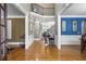 Spacious foyer with hardwood floors, elegant staircase, and access to living areas at 5925 Water Mark Dr, Cumming, GA 30040