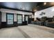 Luxurious home theater with tiered seating, a projector, and black trim for an immersive experience at 5925 Water Mark Dr, Cumming, GA 30040