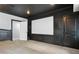 Spacious home theater setup showcasing a blank screen and dark walls for optimal viewing at 5925 Water Mark Dr, Cumming, GA 30040