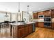Spacious kitchen featuring stainless steel appliances, a large island, hardwood floors, and a breakfast nook at 5925 Water Mark Dr, Cumming, GA 30040