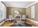 Stylish living room featuring hardwood floors, neutral paint, and ample natural light at 5925 Water Mark Dr, Cumming, GA 30040
