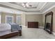 Main bedroom with a large mirror and wood dresser at 5925 Water Mark Dr, Cumming, GA 30040
