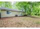 Spacious backyard with lush foliage at 6185 Marbut Farms, Lithonia, GA 30058