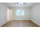 This bedroom features neutral walls, a window with blinds, and carpeted floors at 6185 Marbut Farms, Lithonia, GA 30058