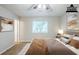 Staged main bedroom with carpet, natural light, and neutral tones for a comfortable atmosphere at 6185 Marbut Farms, Lithonia, GA 30058