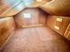 Attic bedroom features wood paneled walls and neutral colored carpet and a window at 1292 Lorenzo Sw Dr, Atlanta, GA 30310