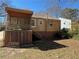 Backyard of house with small screened porch and staircase, offering outdoor potential at 1292 Lorenzo Sw Dr, Atlanta, GA 30310