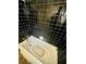 Bathroom featuring black tile walls, white tub, and basic fixtures at 1292 Lorenzo Sw Dr, Atlanta, GA 30310