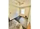 Modest bedroom with ceiling fan, window and visible flooring at 1292 Lorenzo Sw Dr, Atlanta, GA 30310