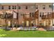 Brick townhome featuring a backyard with multiple patios and decks, ideal for outdoor living at 1547 Cambridge Pl, Marietta, GA 30062