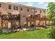 Charming brick townhome with multiple patios and decks overlooking a spacious green lawn at 1547 Cambridge Pl, Marietta, GA 30062